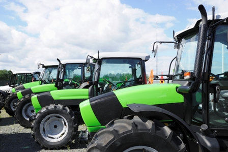 Line of Small Green Tractors